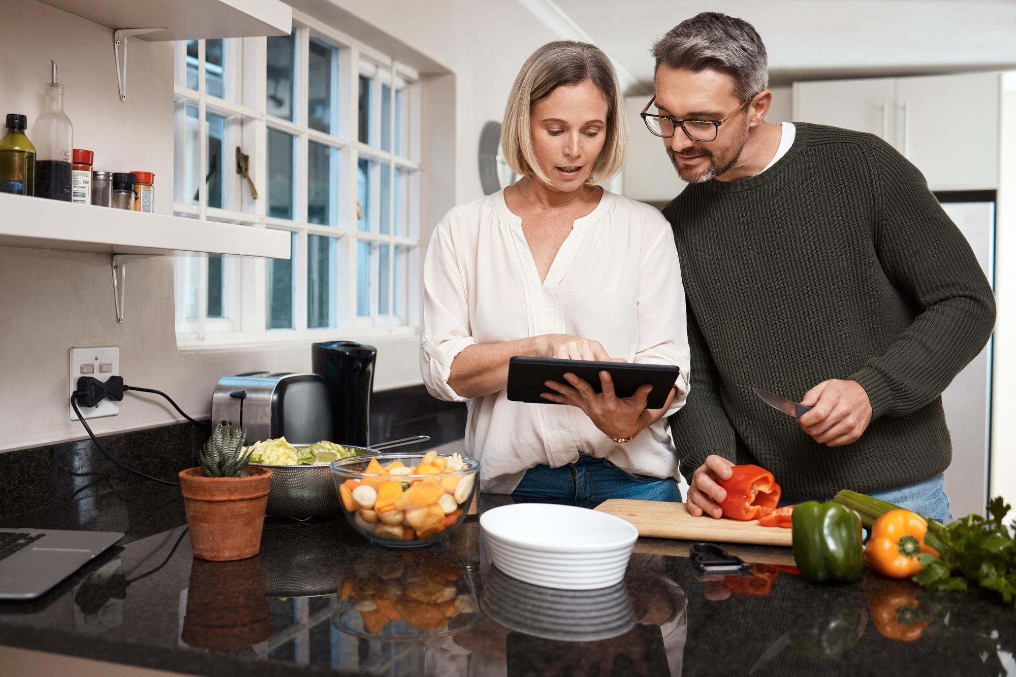 Couple planning in a remodeled kitchen